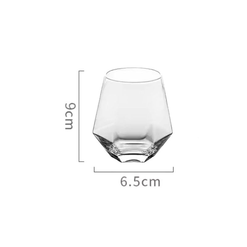 Clear hexagonal glass with dimensions: 9cm x 6.5cm.