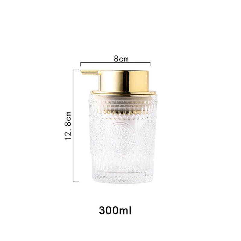 Clear glass foam soap dispenser with ornate patterns and a gold pump, isolated on a white background. Dimensions: 8cm width, 12.8cm height, and 300ml capacity.