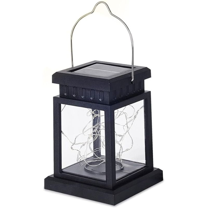 A black solar-powered lantern with a metal handle and clear glass panels, showcasing delicate silver wire LED fairy lights inside. The top features a solar panel for charging, designed for outdoor or indoor decorative lighting.