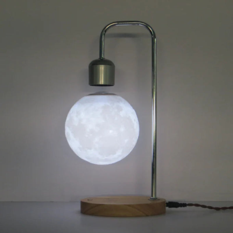 Levitating wireless charger moon lamp, featuring a floating moon design that doubles as a stylish and efficient device charger.