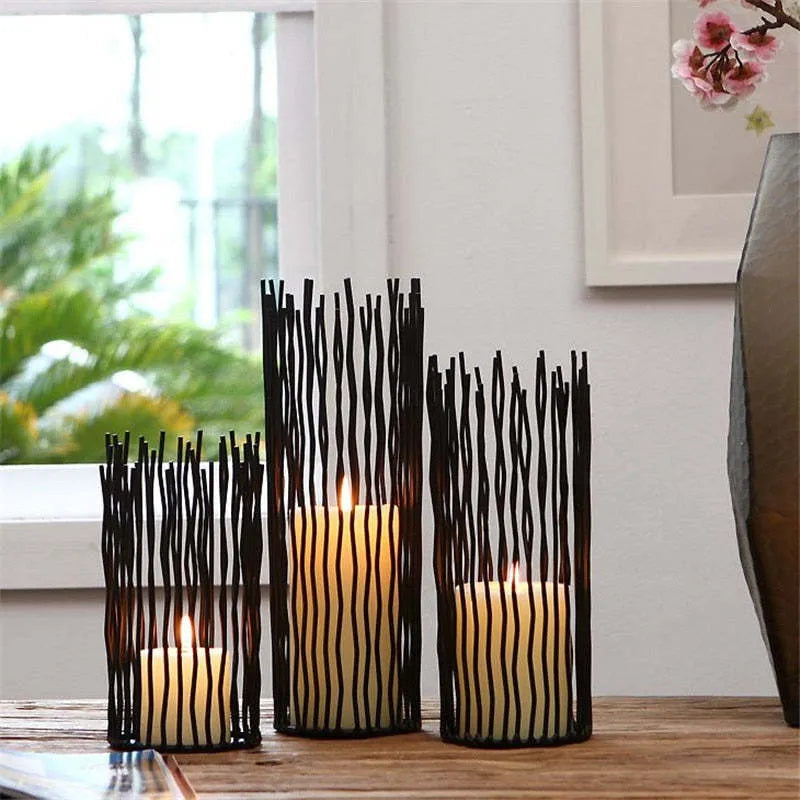 Sleek iron candle stands, perfect for creating a warm and elegant ambiance with your favorite candles.