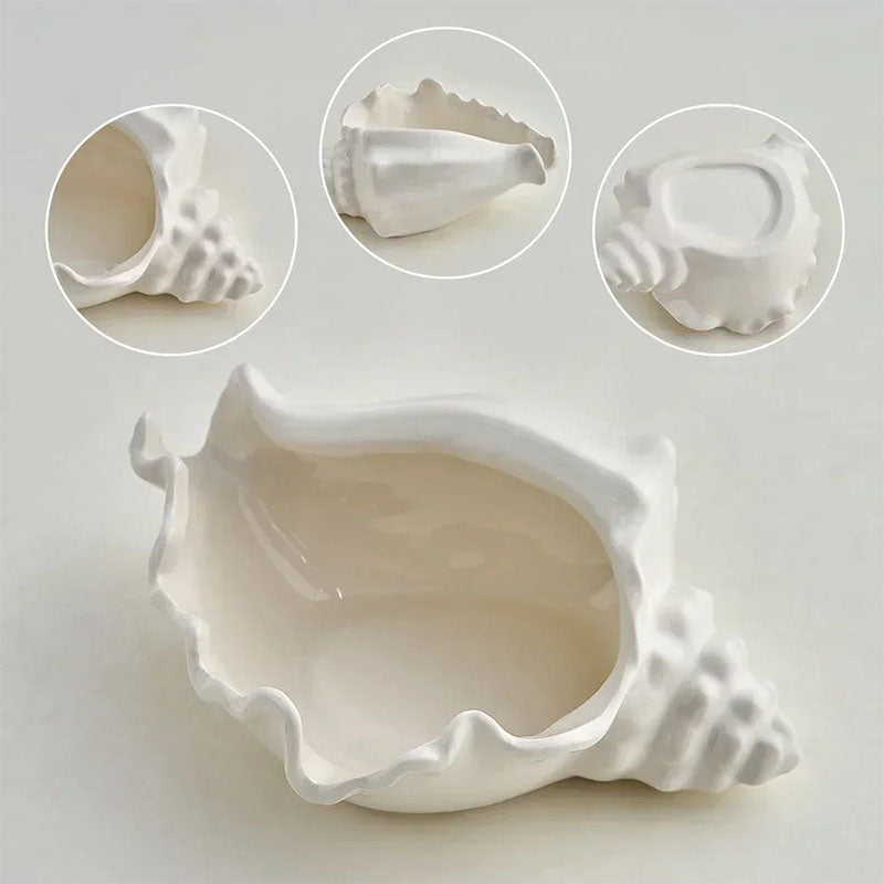 A white ceramic seashell-shaped jewelry dish with multiple angle views highlighting its detailed design and smooth glossy finish.