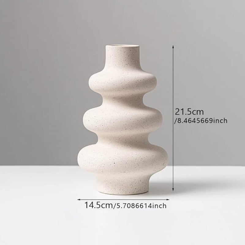 Large rippled ceramic vase on a table , with measurements shown.