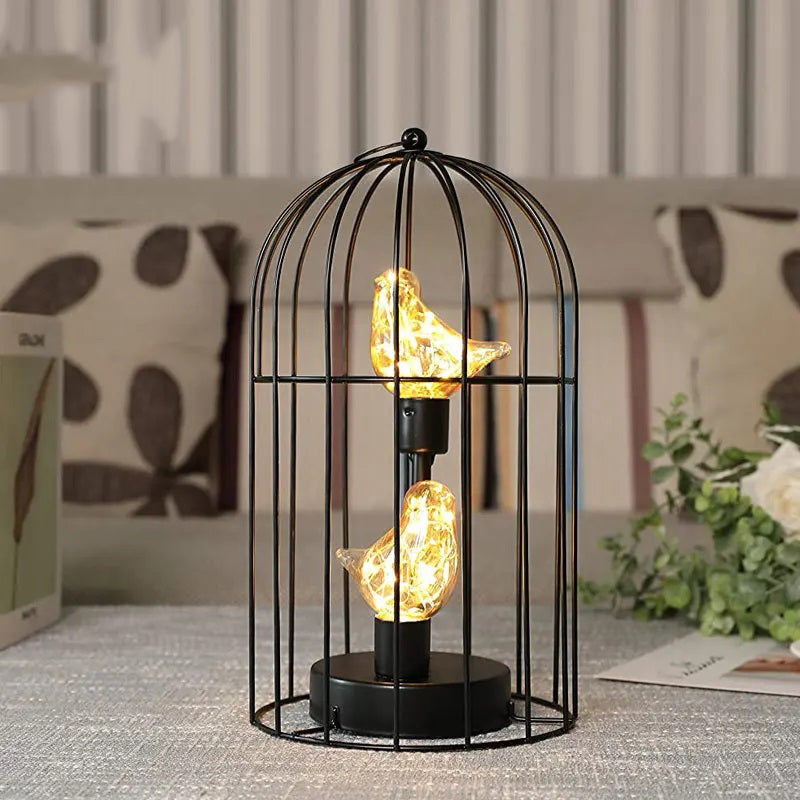Decorative lamp with birdcage design on a table