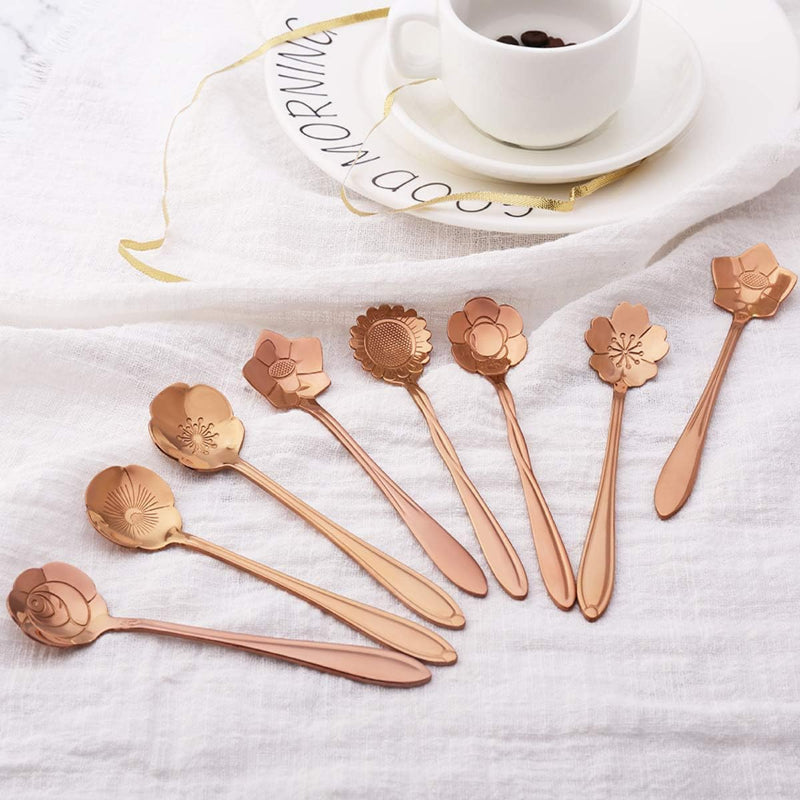 Rose gold flower spoons and a cup of coffee.
