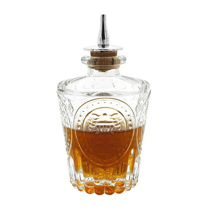 This bottle has a royal, ornate design with an embossed crest-like emblem, giving it a sophisticated and classic feel.