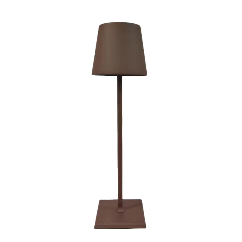 A modern brown table lamp with a conical lampshade, slim cylindrical stem, and square base, all in a matte brown finish.