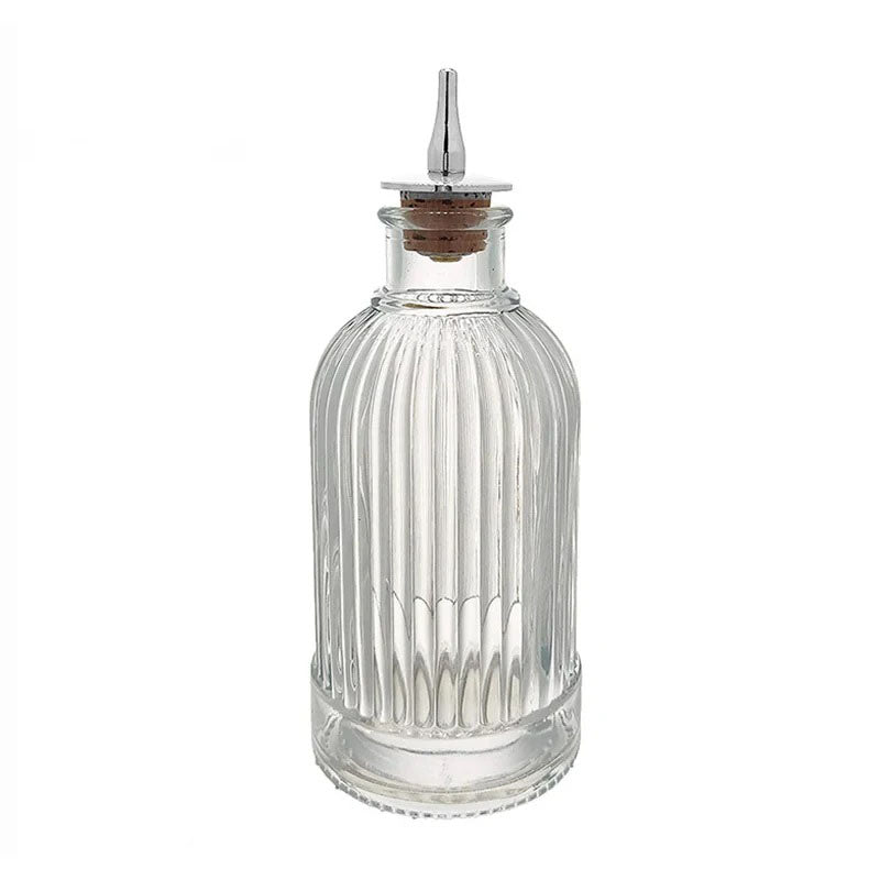 This bottle features an elegant ribbed glass design, offering a classic and timeless look.