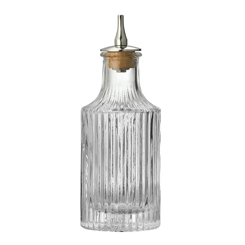 This bottle features a sleek vertical ribbed design, extending from the base to the neck. It has a slightly flared top, giving it a sophisticated touch while maintaining a minimalist look.