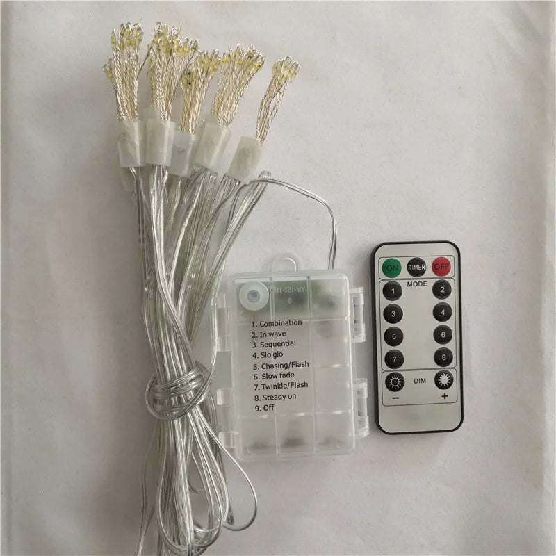 Rolled-up string lights with a battery pack showing 9 modes and a remote control.