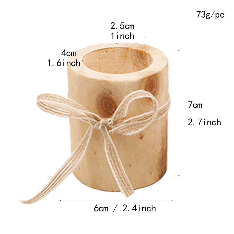 A light-colored cylindrical wooden candle holder with a burlap ribbon tied around it is shown against a white background. Dimensions indicate an inner diameter of 4 cm (1.6 inches), an inner depth of 2.5 cm (1 inch), a height of 7 cm (2.7 inches), and an outer diameter of 6 cm (2.4 inches). It weighs 73g.