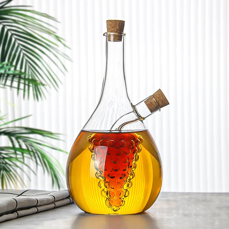 Glass decanter with cork stoppers on a surface with a blurred plant background