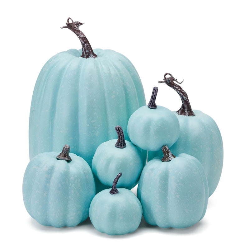 A cluster of light blue decorative pumpkins of various sizes with grey stems.