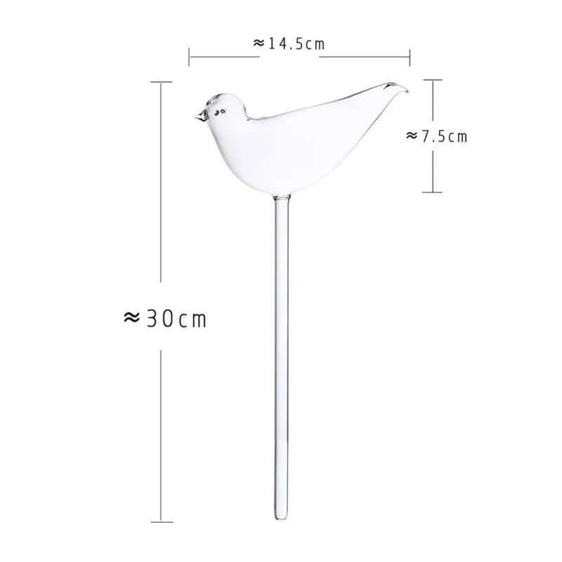 A clear glass bird-shaped self-watering bulb is displayed with approximate measurements: the bird is about 14.5 cm long and 7.5 cm high, and the total length of the waterer, including the spike, is approximately 30 cm.