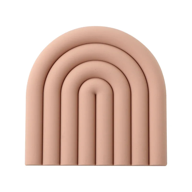 Soft and flexible rainbow coasters protecting surfaces from spills.