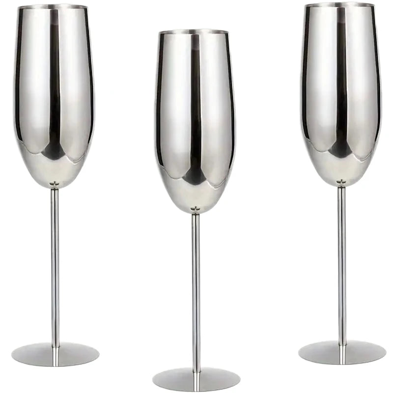A set of three stainless steel champagne flutes with a polished silver finish, featuring a sleek, modern design with long, slender stems—ideal for adding sophistication to any celebration.