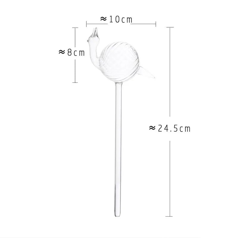 A clear glass, snail-shaped plant waterer is shown with approximate dimensions: the snail body is about 10 cm long and 8 cm high, and the total length of the waterer, including the spike, is approximately 24.5 cm.