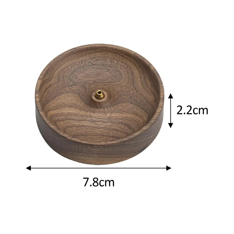 A top-down, close-up image shows a round, light brown wooden incense burner with swirling grain, isolated on a white background. A small, golden cylindrical piece with a hole is in the center. Arrows indicate the burner's diameter is 7.8 cm and its height is 2.2 cm.