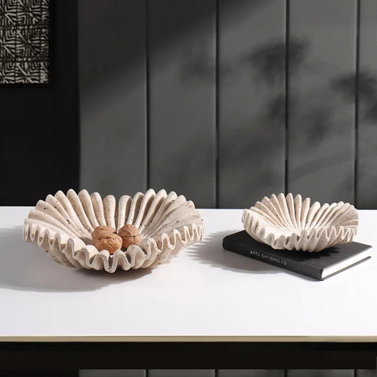 Elegant scalloped travertine bowl – Natural stone decor for modern homes.