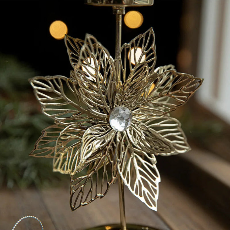 Close-up of a gold poinsettia decoration with a clear gem center.