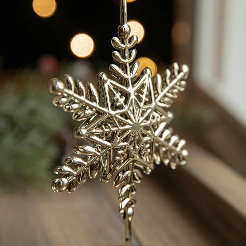 Close-up of a decorative gold snowflake ornament.