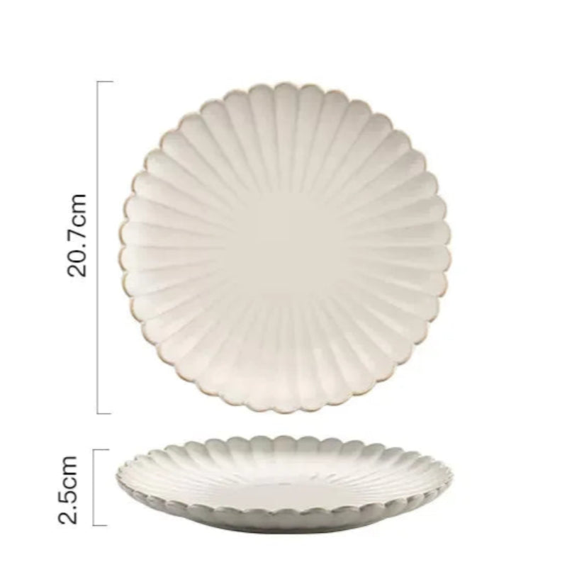 A round ceramic plate with a scalloped edge and raised ridges, measuring 20.7cm in diameter and 2.5cm in height.