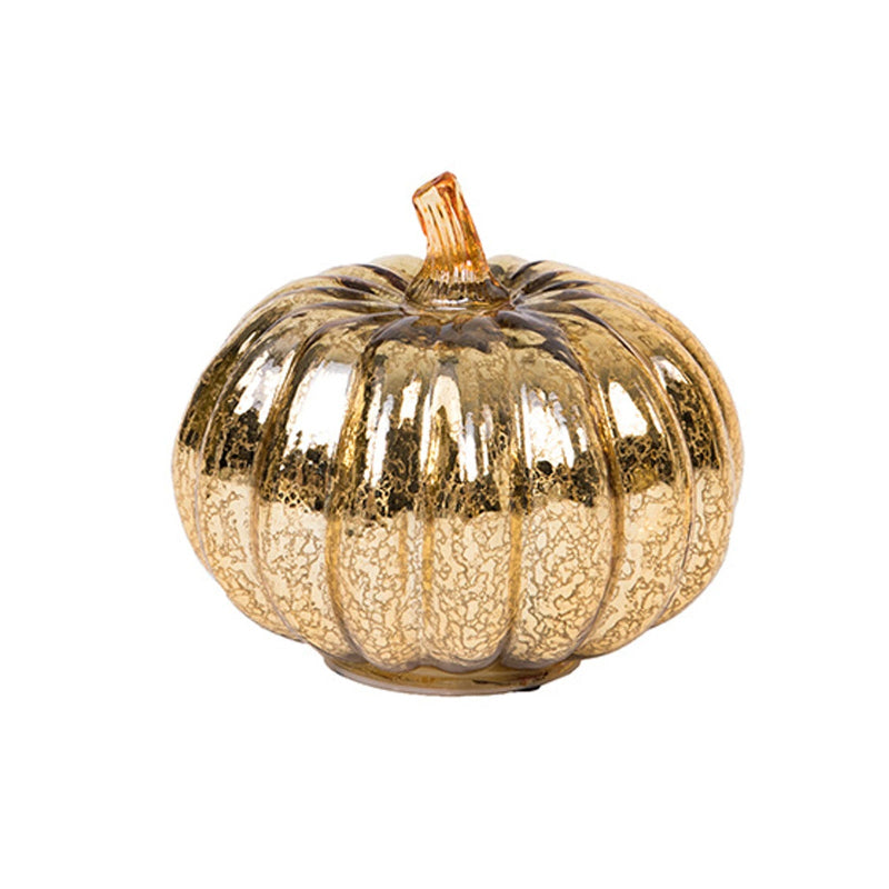 A gold-colored pumpkin decoration with a textured, metallic finish, isolated on a white background.