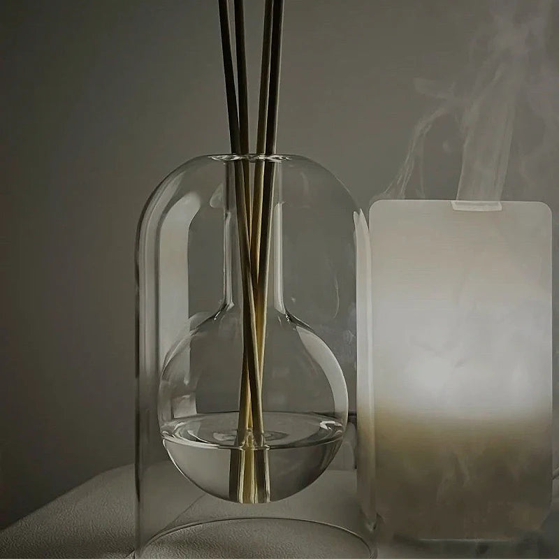 Stylish glass diffuser with a gentle misting function, perfect for creating a soothing atmosphere.