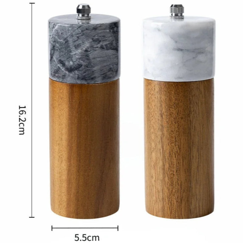 Two spice grinders with wood bases and marble tops, showing dimensions.