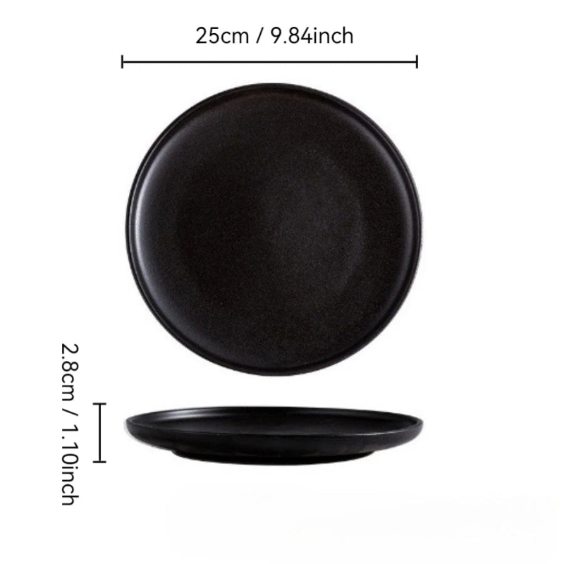 A round, black plate with a textured, matte finish, measuring 25cm (9.84 inches) in diameter and 2.8cm (1.10 inches) in height.
