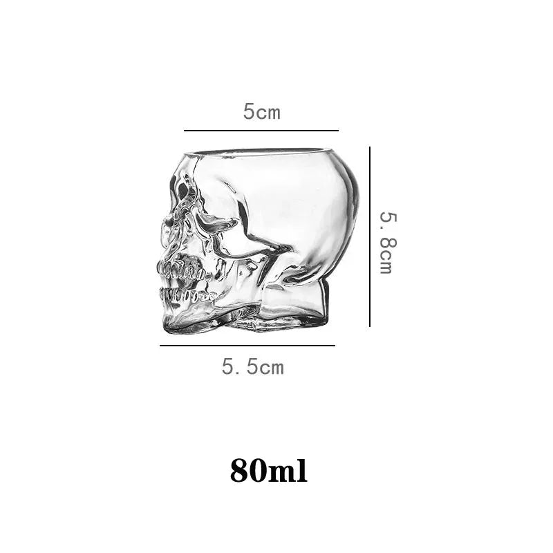 A diagram of a small, clear glass skull cup, showing its dimensions: 5.8cm tall, 5.5cm wide, 5cm deep at the top, and a capacity of 80ml.