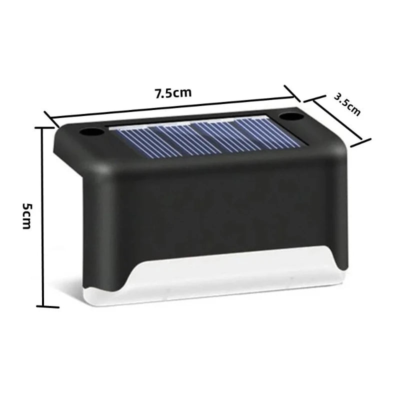 A diagram shows the dimensions of a small, rectangular, dark-colored solar-powered step light. The light has a solar panel on top and a white light-emitting section at the bottom. Arrows indicate the width is 7.5 cm, the height is 5 cm, and the depth is 3.5 cm.