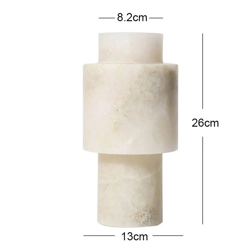 A tall alabaster vase with a modern, geometric design. The vase has a cylindrical shape with layered sections, featuring a natural off-white color with subtle veining. Dimensions are labeled: 8.2 cm for the top opening, 13 cm for the widest section, and 26 cm in height.