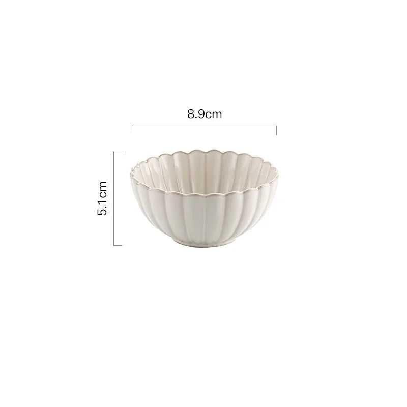 A ceramic bowl with a scalloped rim and vertical ridges, measuring 8.9cm in diameter and 5.1cm in height.