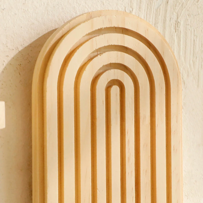 Modern geometric wall shelf for plants, books, and home accessories.