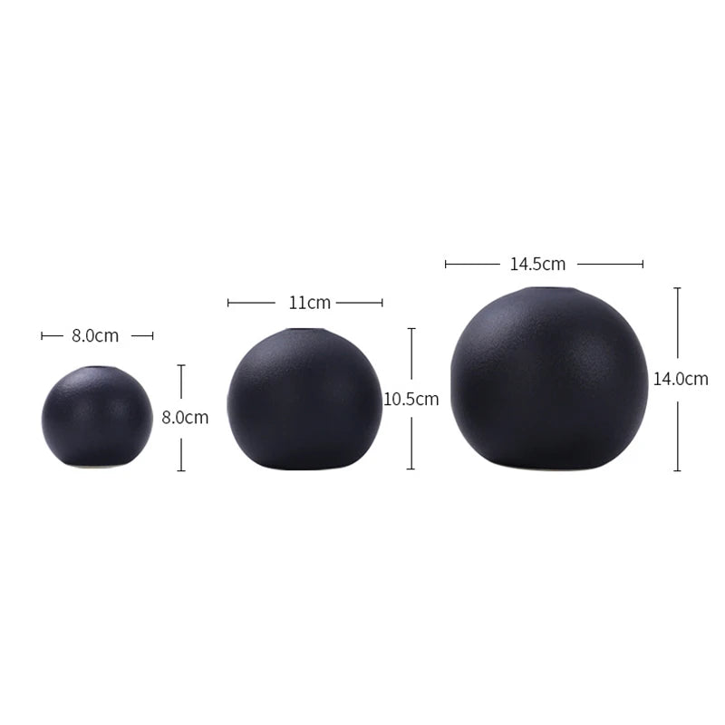 Three matte black round ceramic vases in different sizes, displayed side by side with dimensions labeled: small (8cm x 8cm), medium (11cm x 10.5cm), and large (14.5cm x 14cm).