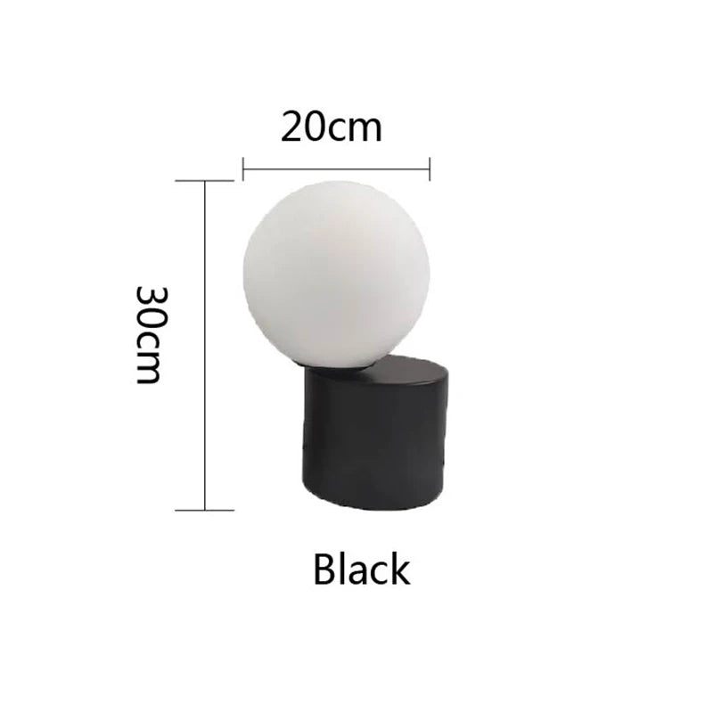 A white spherical lamp with a black cylindrical base is displayed against a white background, with text indicating the lamp's dimensions: 20cm width and 30cm height. The base is labeled "Black."