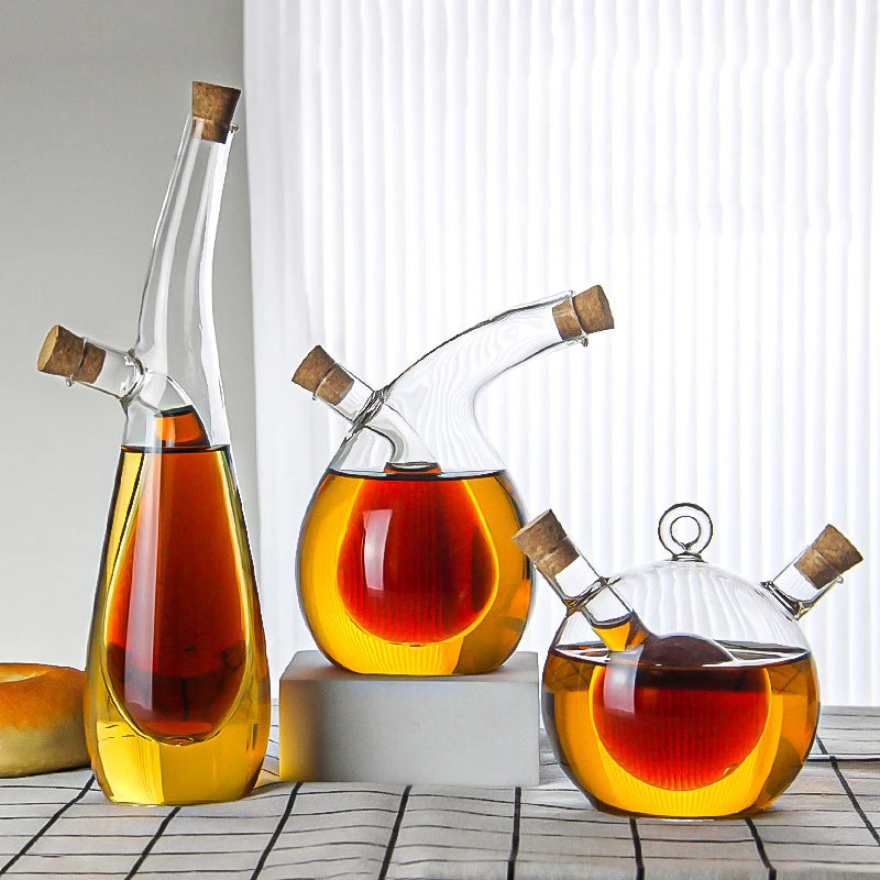 Set of glass decanters with cork stoppers on a white background