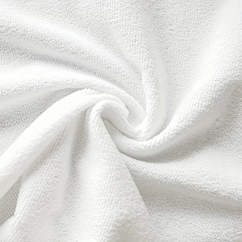 Close-up of white textured fabric with a swirl pattern