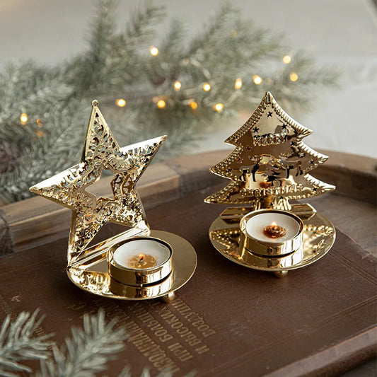 Two golden Christmas tea light holders, one star-shaped and one tree-shaped.