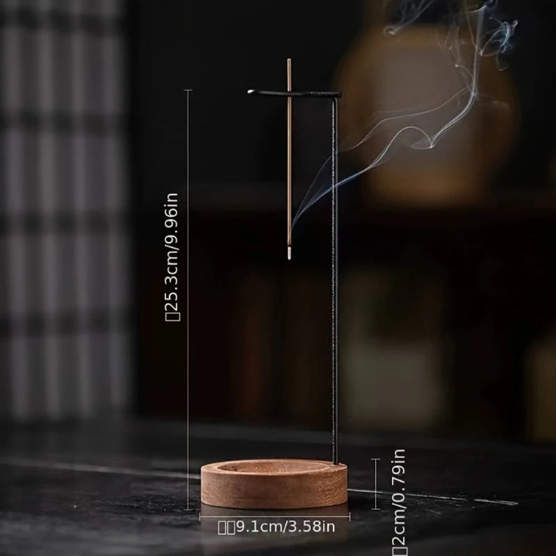 A burning incense stick in a modern holder with dimensions labeled.