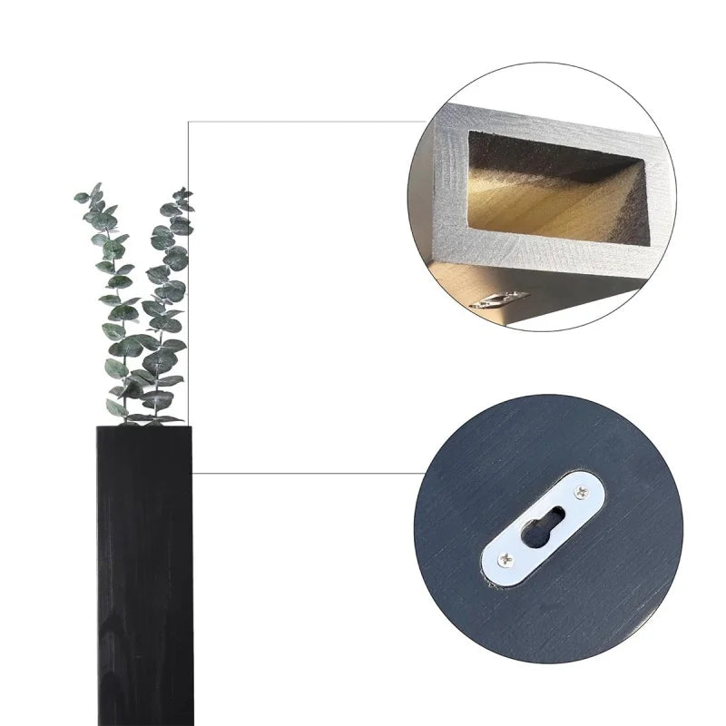 Close-up view of a black wall-mounted planter, highlighting its hollow interior for holding plants and a keyhole bracket for easy installation.