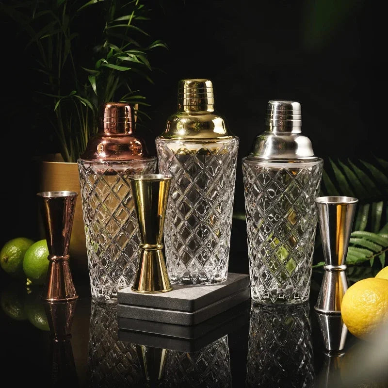 Glass cocktail shaker with a stainless steel lid, perfect for mixing cocktails at home.