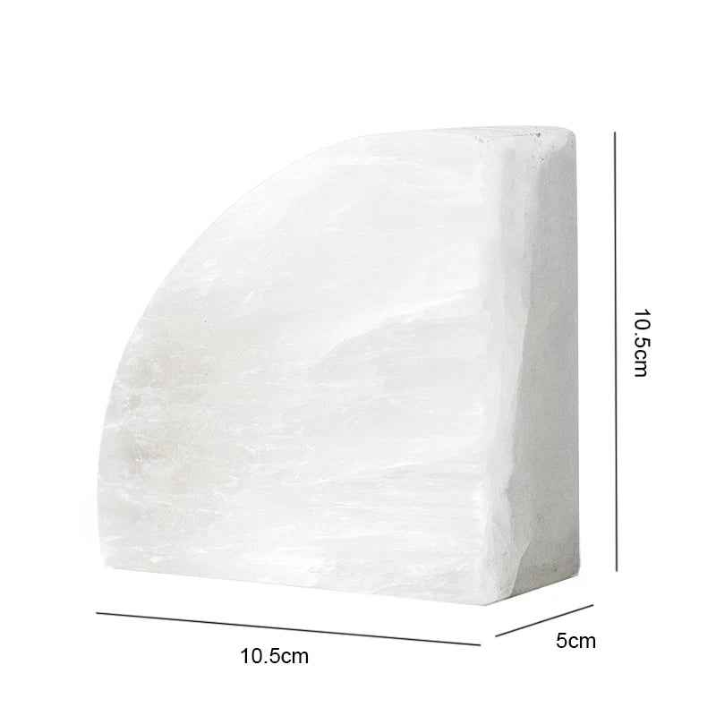 A white semi-circular crystal block with a flat back and smooth curved front, measuring 10.5 cm in width and height, and 5 cm in depth.