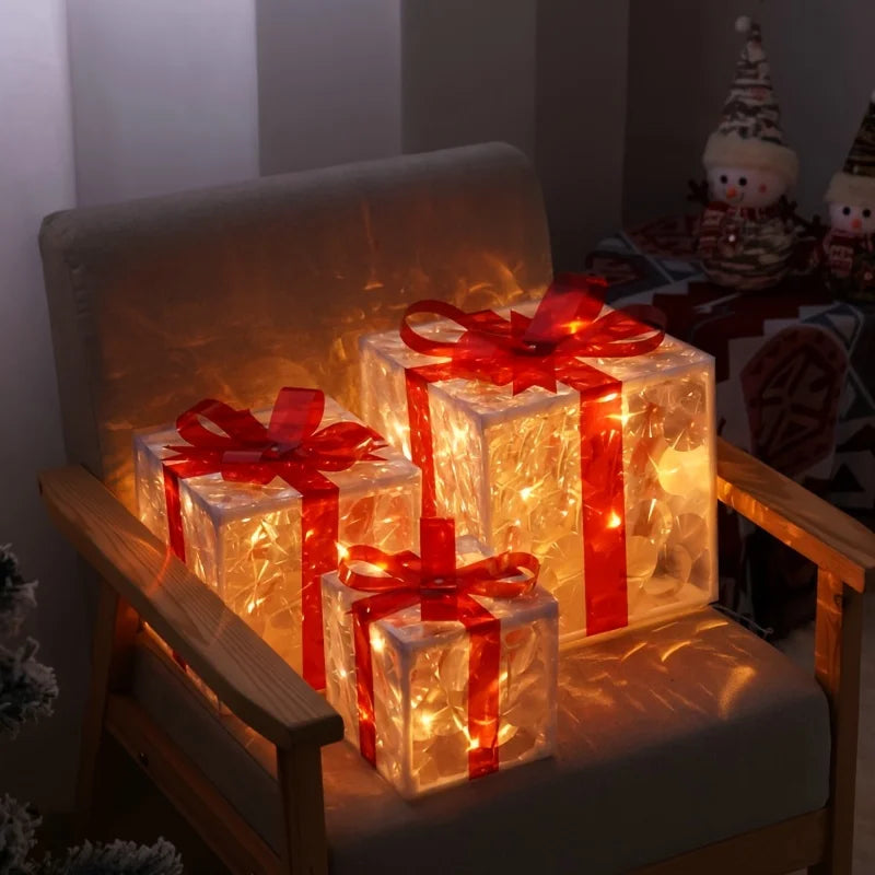 Three luminous gift boxes with red bows sit on an armchair, creating a warm glow.