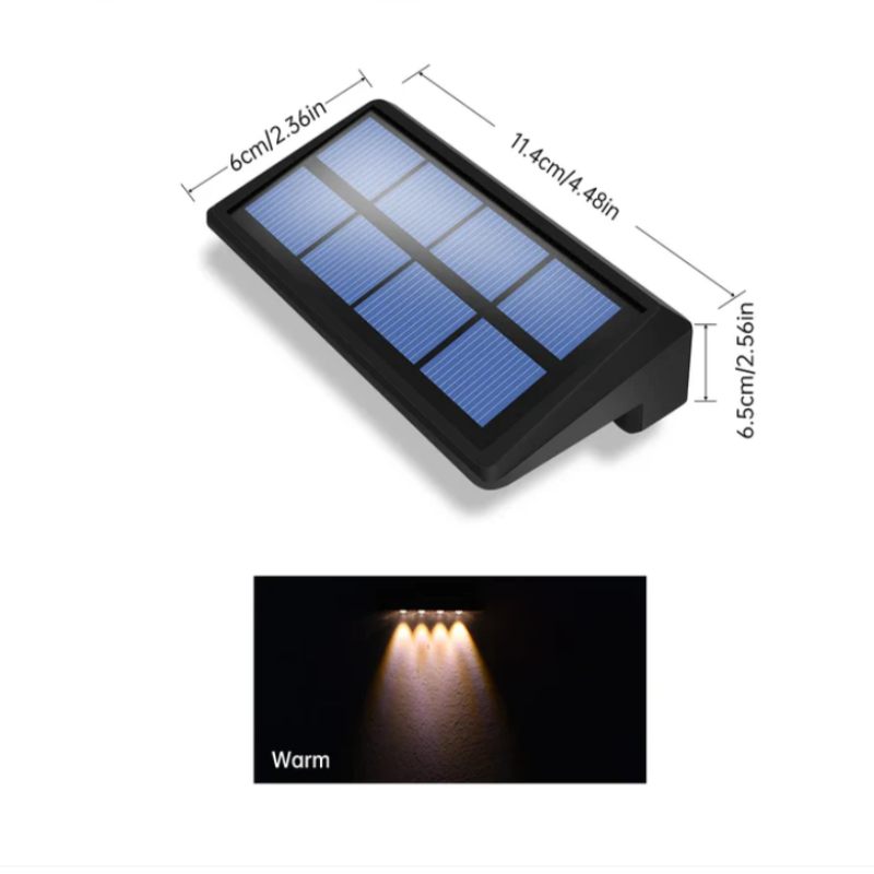 A diagram shows the dimensions of a black solar fence light with a blue solar panel as 11.4 cm/4.48 inches in length, 6 cm/2.36 inches in width, and 6.5 cm/2.56 inches in height. Below the diagram, a graphic illustrates the warm white light emitted by the fixture's LEDs.