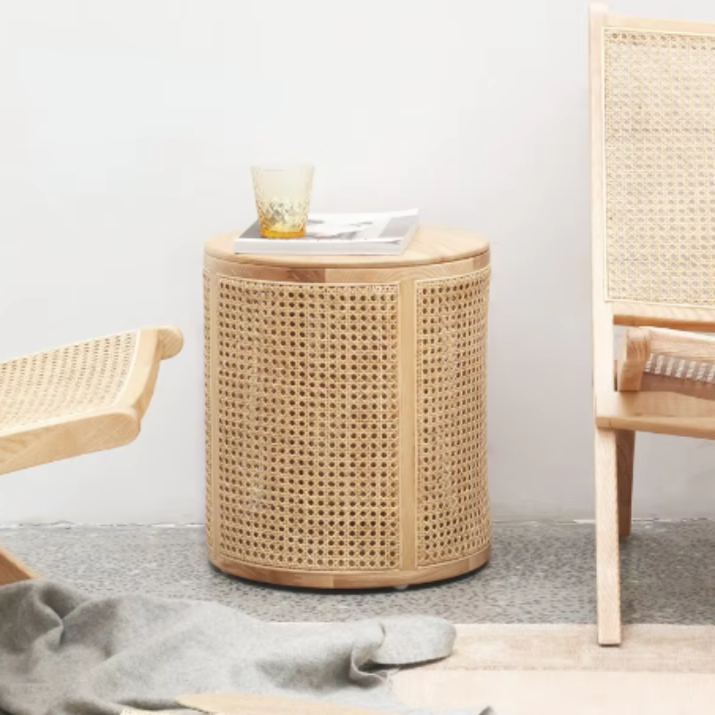 Compact rattan side table with hidden storage for a clutter-free space.