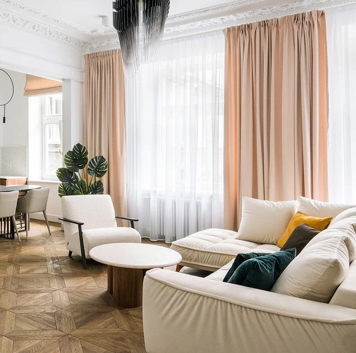 Modern living room with neutral tones, organic textures, and nature-inspired home decor from Kiyo Home.