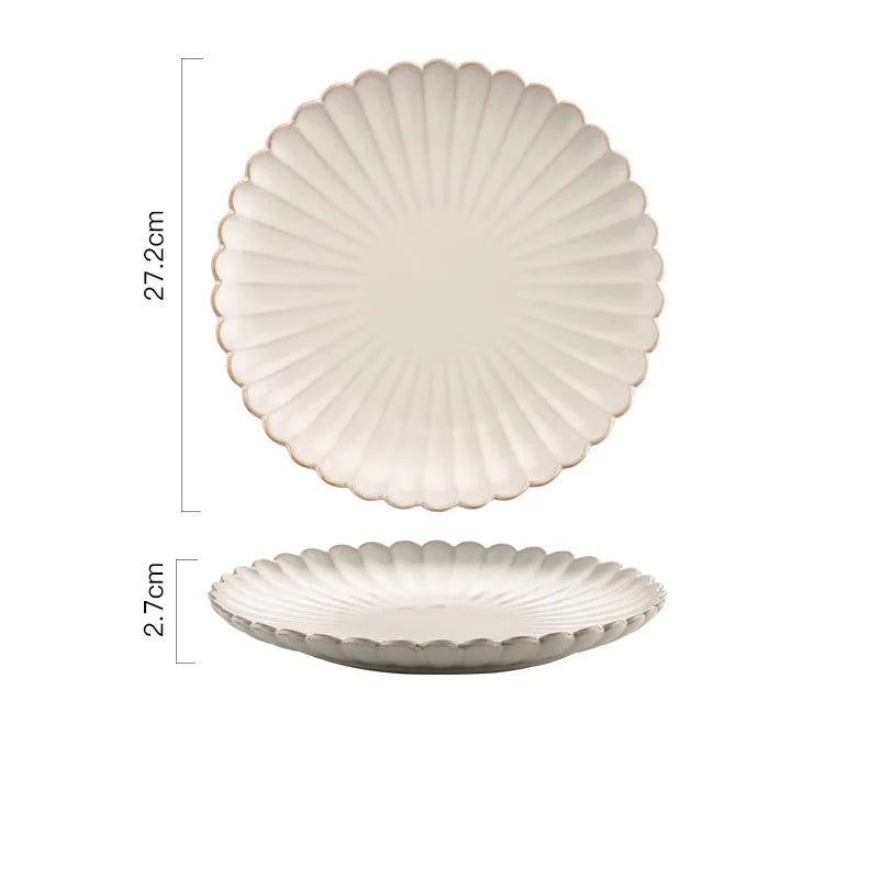 A round ceramic plate with a scalloped edge and raised ridges, measuring 27.2cm in diameter and 2.7cm in height.