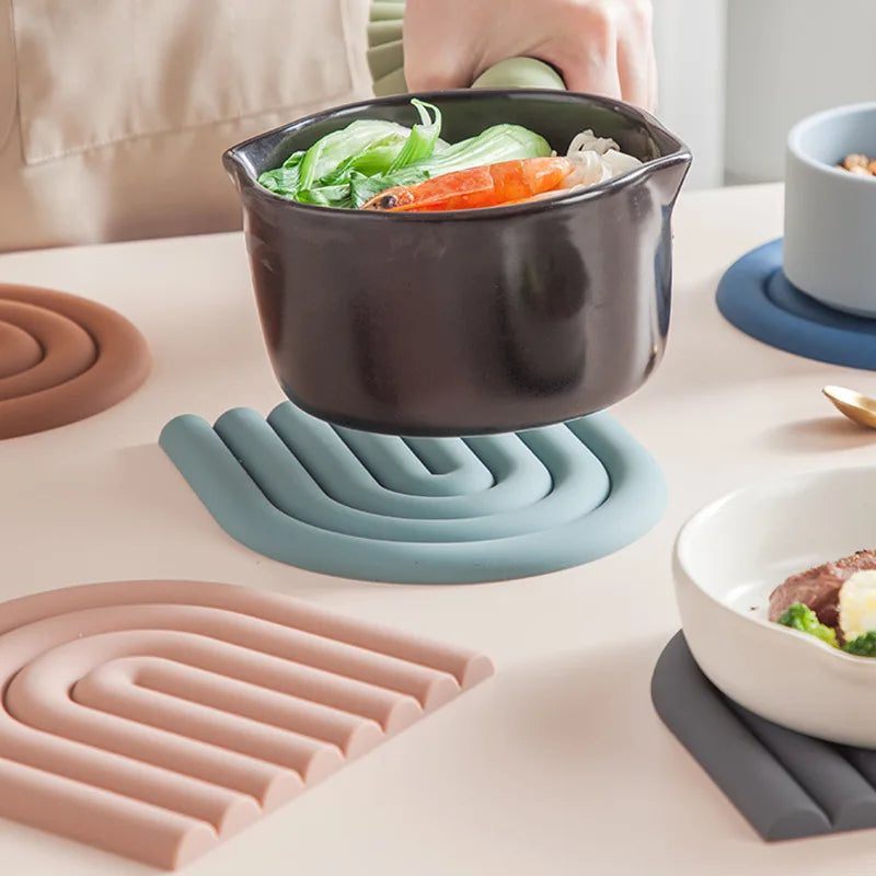 Durable and waterproof silicone coasters with a playful rainbow look.
